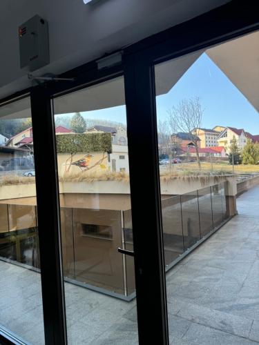a view through the windows of a building at CityCenter Heart - Ultracentral & Panoramic View in Reşiţa