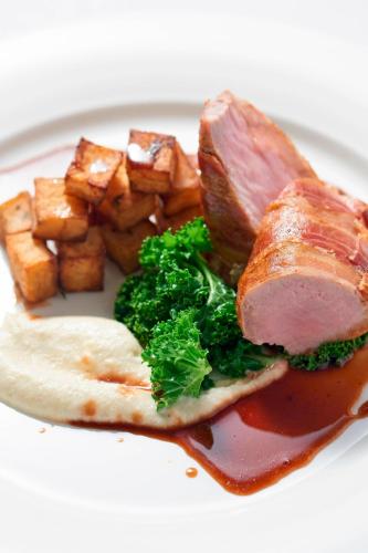 a plate of food with meat and broccoli and potatoes at The Glasshouse, Autograph Collection in Edinburgh