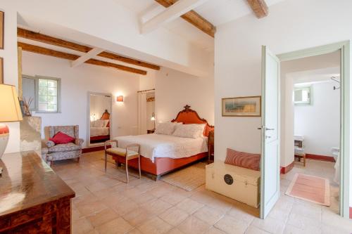 a bedroom with a bed and a living room at Vigna Luisa Resort - Near Rome in Genzano di Roma