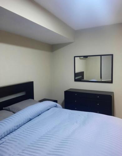 Ένα ή περισσότερα κρεβάτια σε δωμάτιο στο Hermoso Apt remodelado en La Florida - 2H 2B