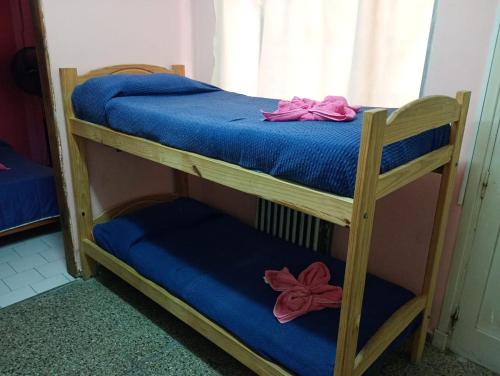 En eller flere senge i et værelse på Palmeras Del Tuyu