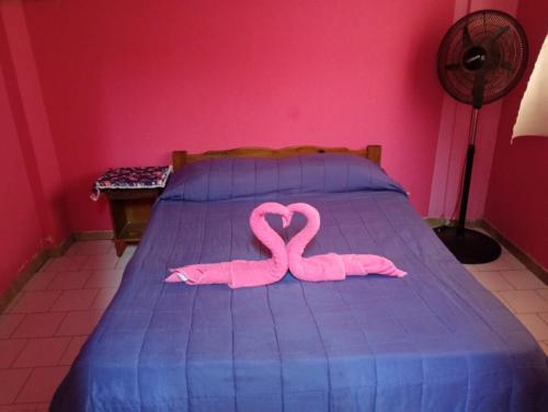 En eller flere senge i et værelse på Palmeras Del Tuyu