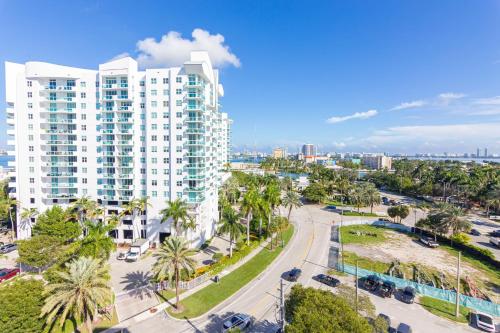 an aerial view of a city with a tall building at North Bay in Miami Beach