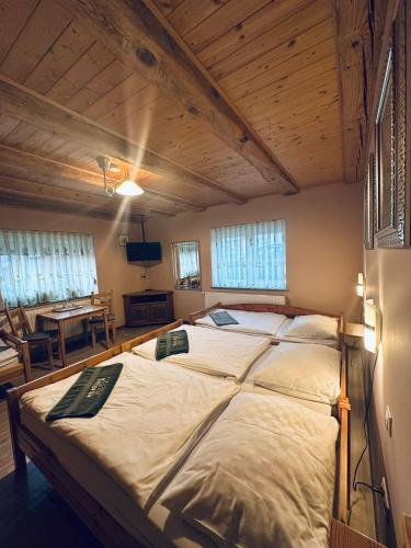 a bedroom with a large bed in a room at La Villa Pergola in Szentgotthárd
