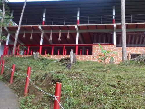 a building with a fence in front of it at Hostal la Gran Ceci in Santa Marta