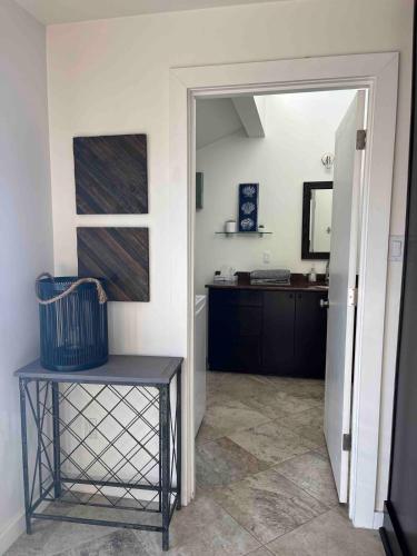 a hallway with a door open to a room with a desk at Lakefront retreat close to Microsoft and Bellevue in Redmond