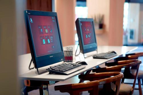 two computer monitors sitting on top of a table at Marriott at the University of Dayton in Dayton