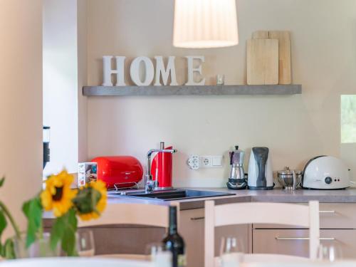 a kitchen with a red appliance on a counter at Jäger in Maria Alm am Steinernen Meer