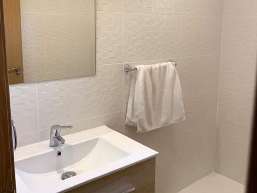 a white bathroom with a sink and a shower at Mansion in Riudoms with private pool in Riudoms