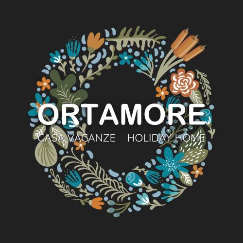 a wreath of flowers and the words offeralore as a landscape holiday home at Appartamento Vacanze - Holiday Apartment "Ortamore" in Orta San Giulio