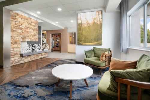 a living room with a couch and a table at Fairfield Inn Scranton in Scranton