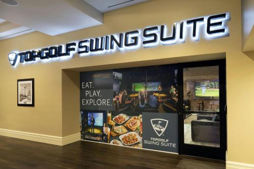 a pizza store with a sign on the wall at Courtyard by Marriott Long Beach Downtown in Long Beach