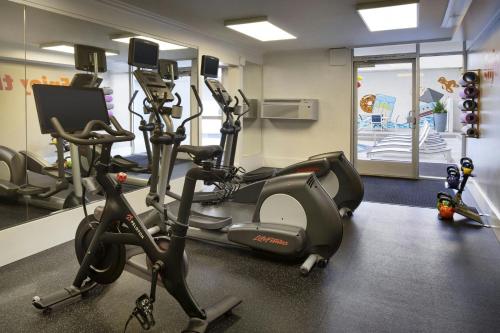 a gym with several exercise bikes in a room at Courtyard by Marriott Long Beach Downtown in Long Beach