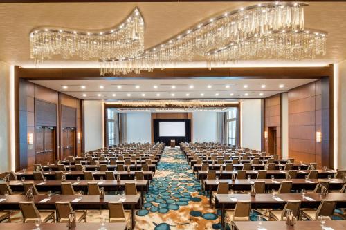 a large banquet hall with chandeliers and tables at The Westin Sarasota in Sarasota