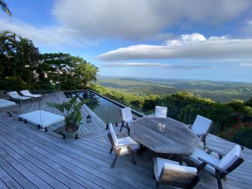 a deck with a table and chairs and a view at Balmoral 575 in Montville