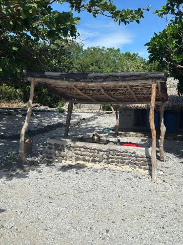 a wooden bench sitting on top of some rocks at Dreamscape Villa in Batangas City