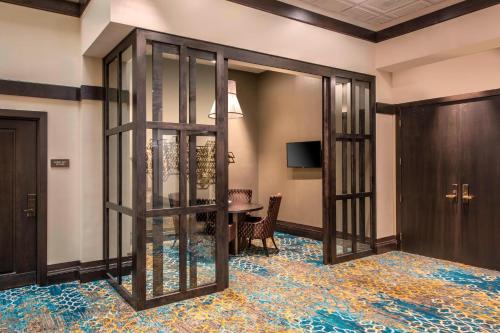 a lobby with glass doors and a table at Courtyard by Marriott Denver Downtown in Denver