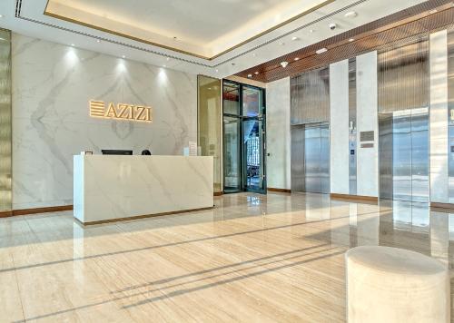 a lobby with a reception desk in a building at Paradise Point in Dubai
