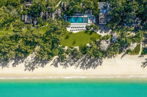 an aerial view of a house on a beach at Renaissance Phuket Resort & Spa in Mai Khao Beach