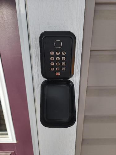 a close up of a remote control in a room at Cozy Luxury House in Edmonton
