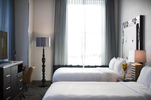 a hotel room with two beds and a window at Renaissance Pittsburgh Hotel in Pittsburgh