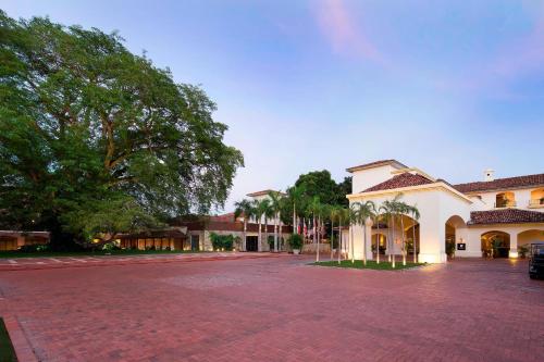 an empty parking lot in front of a building at The Buenaventura Golf & Beach Resort, Autograph Collection in Playa Blanca