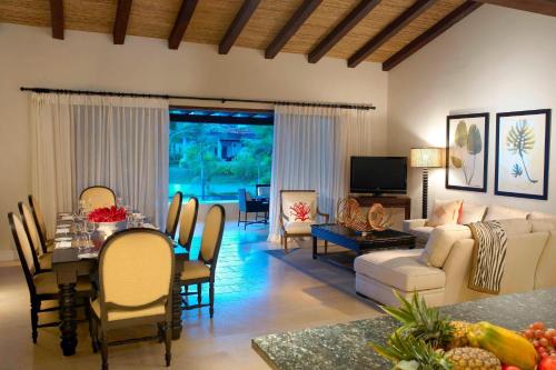 a living room with a couch and a table at The Buenaventura Golf & Beach Resort, Autograph Collection in Playa Blanca