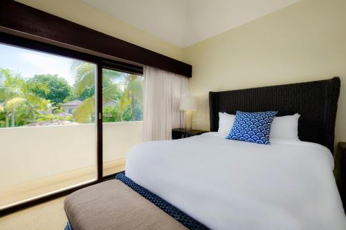 a bedroom with a bed and a large window at The Buenaventura Golf & Beach Resort, Autograph Collection in Playa Blanca