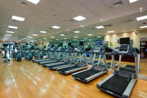 a gym with a row of treadmills and machines at The Buenaventura Golf & Beach Resort, Autograph Collection in Playa Blanca