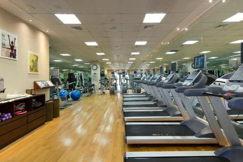 a gym with rows of treadmills and machines at The Buenaventura Golf & Beach Resort, Autograph Collection in Playa Blanca
