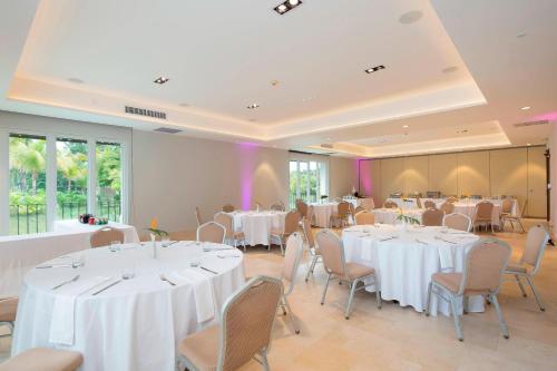 a banquet hall with white tables and chairs at The Buenaventura Golf & Beach Resort, Autograph Collection in Playa Blanca