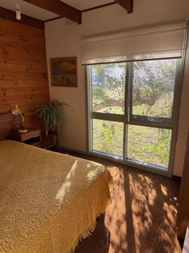 a bedroom with a bed and a large window at Golden Days Shack in Jan Juc, Great For Surfers, Family-Friendly, 4-Min Walk to Beach in Torquay