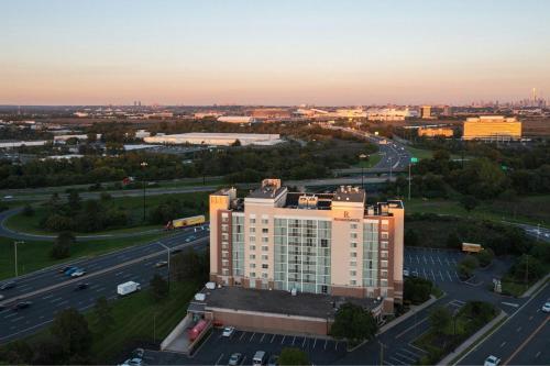 an aerial view of a building with a highway at Renaissance Meadowlands Hotel in Rutherford