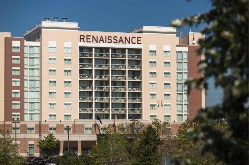 a large building with a sign on it at Renaissance Meadowlands Hotel in Rutherford