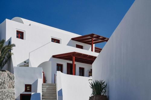 a white house with stairs in front of it at Vedema, a Luxury Collection Resort, Santorini in Megalokhori