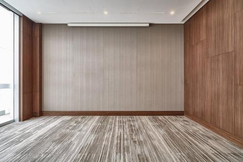 an empty room with a large wall at AC Hotel by Marriott Lima Miraflores in Lima