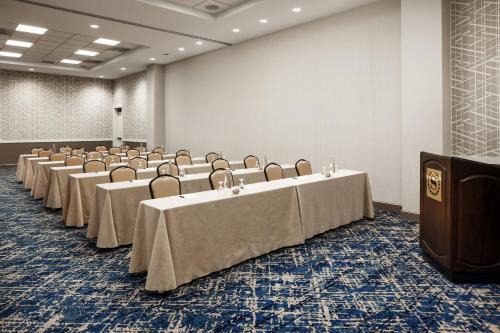 a conference room with tables and chairs and a podium at Sheraton Grand Seattle in Seattle
