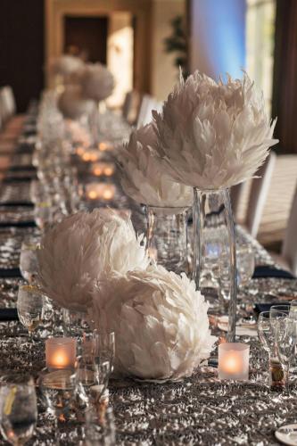 a long table with white flowers and candles on it at Sheraton Grand Seattle in Seattle
