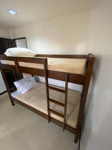a set of bunk beds in a room at Ma Lourdes Inn- Washington Street in Palompon