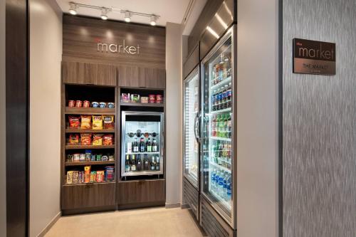 a drink aisle in a grocery store with a refrigerator at Residence Inn by Marriott Scottsdale Salt River in Scottsdale