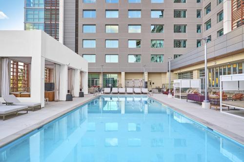 a swimming pool in front of a building at JW Marriott, Anaheim Resort in Anaheim