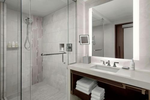a bathroom with a sink and a shower at JW Marriott, Anaheim Resort in Anaheim