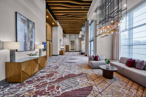 a lobby of a hotel with couches and tables at JW Marriott, Anaheim Resort in Anaheim