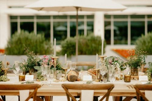 a table set up for a wedding with flowers and candles at JW Marriott, Anaheim Resort in Anaheim