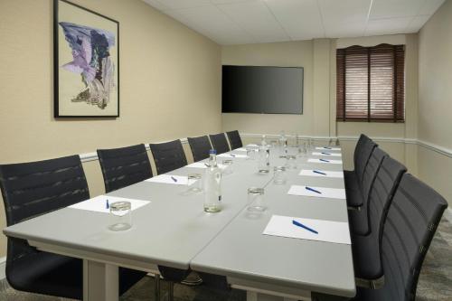 a conference room with a large white table and chairs at Delta Hotels by Marriott Newcastle Gateshead in Newcastle upon Tyne