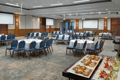 a large banquet hall with tables and chairs at Delta Hotels by Marriott Newcastle Gateshead in Newcastle upon Tyne
