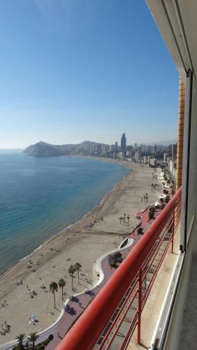 a view of the beach from the balcony of a building at Apartamentos Beni-Beach in Benidorm