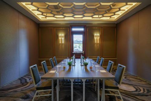 a conference room with a long table and chairs at Renaissance St. Augustine Historic Downtown Hotel in Saint Augustine