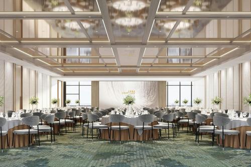 a rendering of a banquet hall with tables and chairs at Courtyard by Marriott Nanning Wuxiang in Nanning