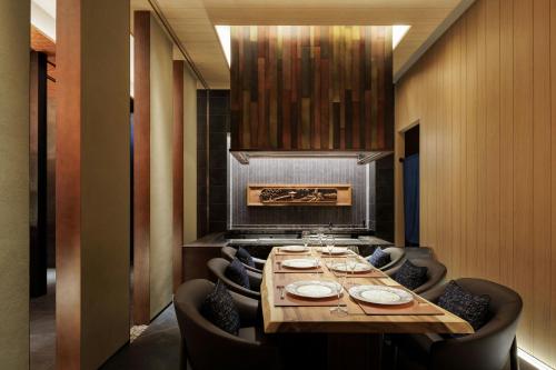 a dining room with a long table and chairs at THE OSAKA STATION HOTEL, Autograph Collection in Osaka